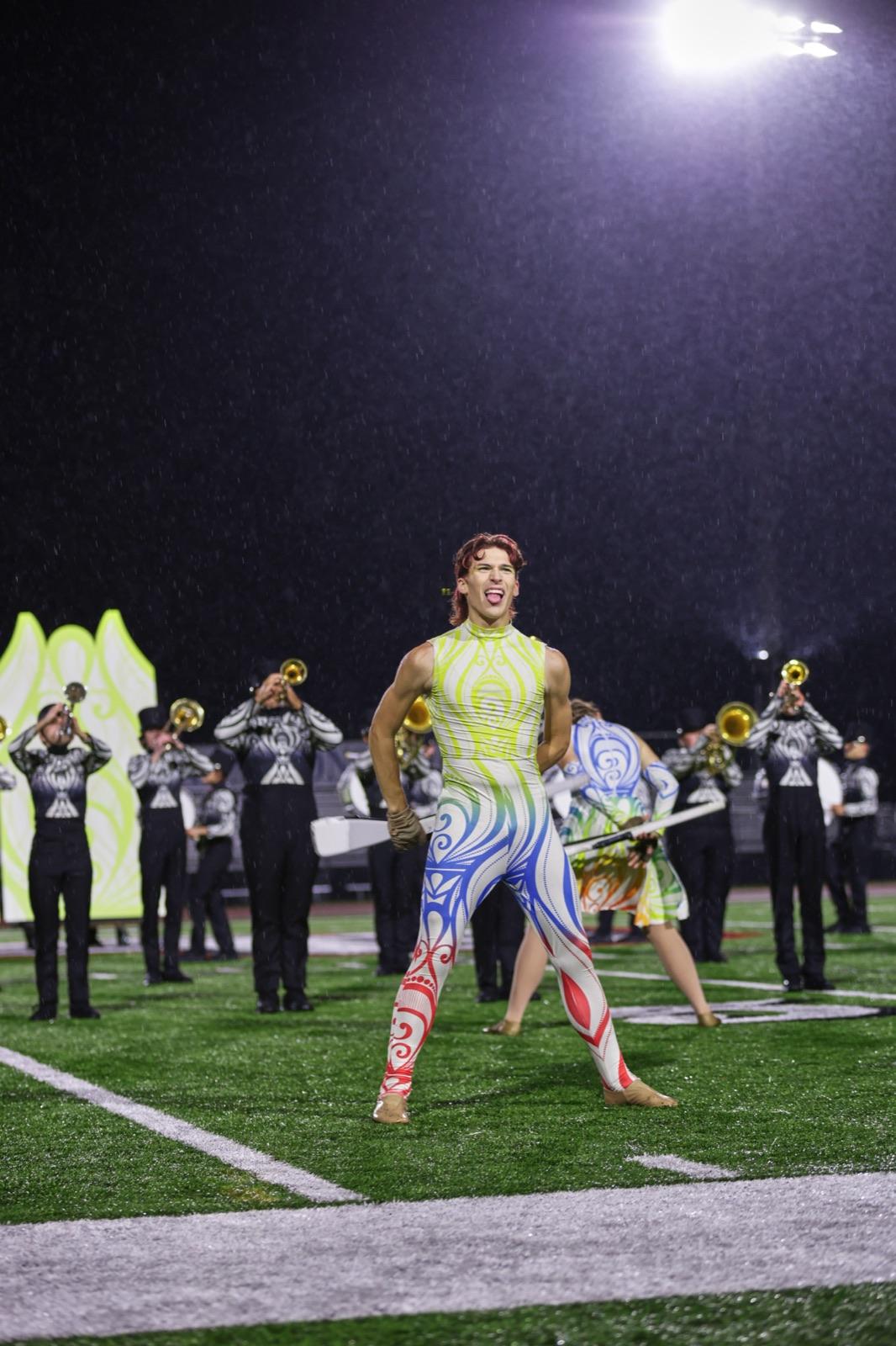 Guard soloist front and center with the brass line behind