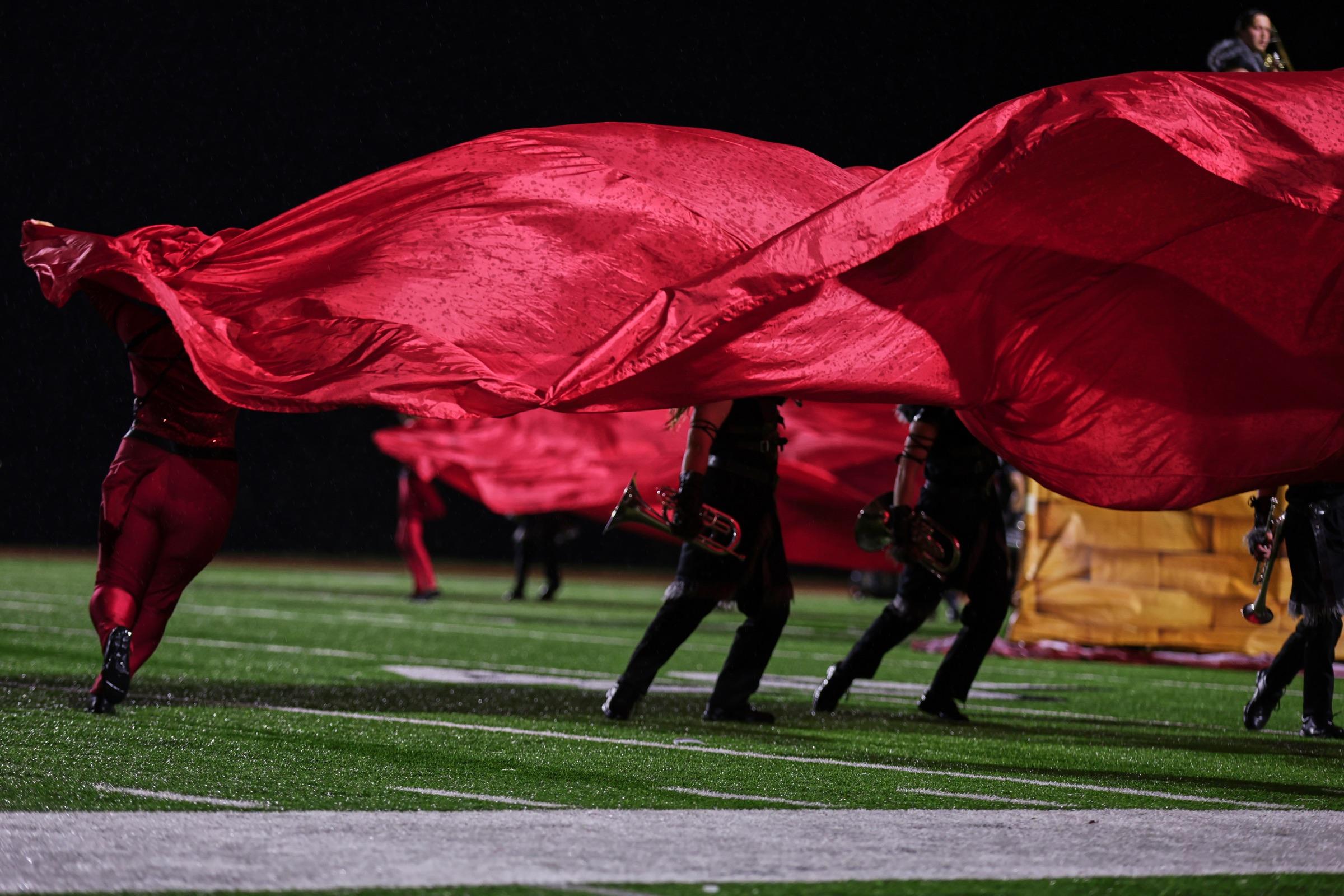 Red silks sweeping across the field